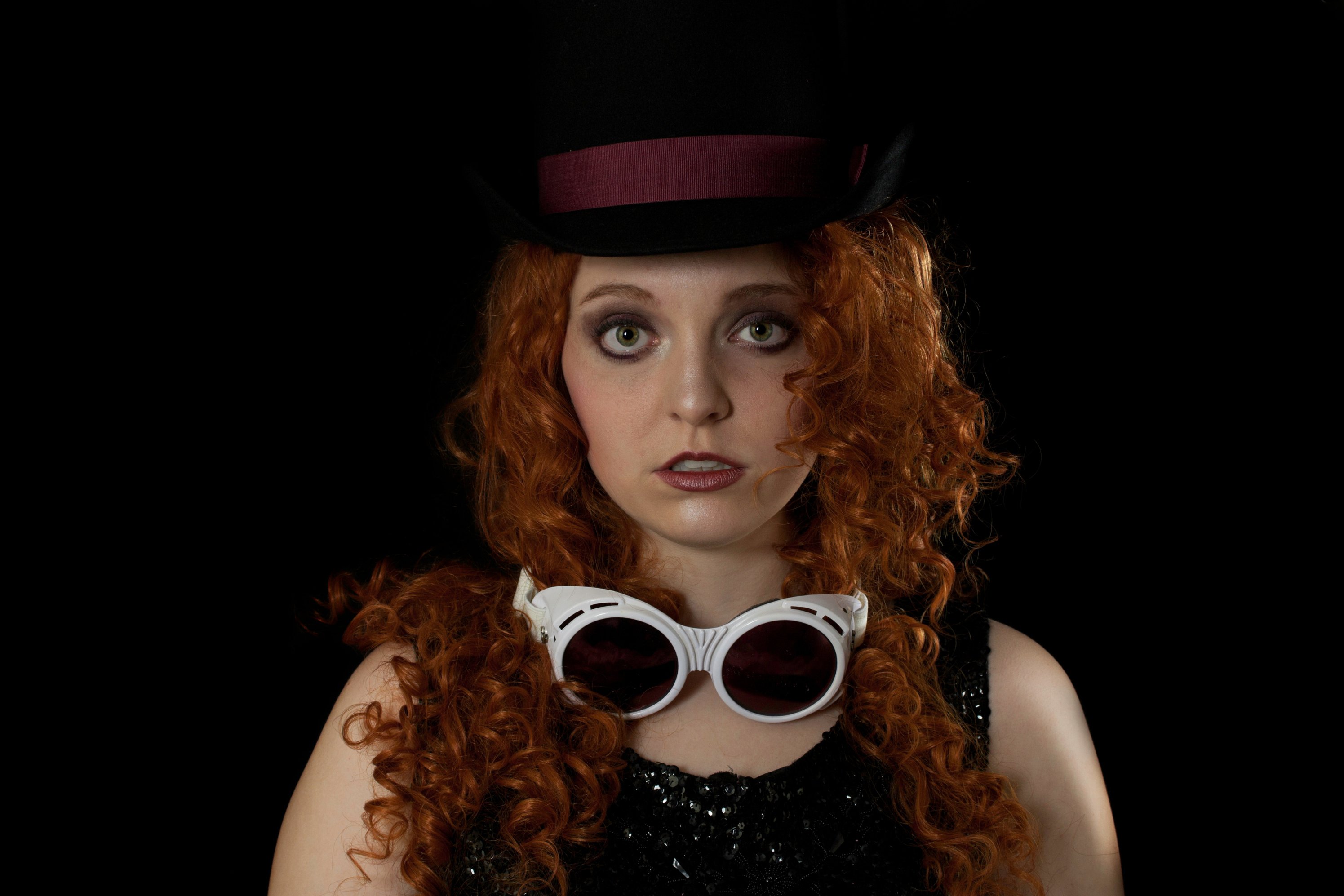 Young Woman in Top Hat and goggles.